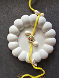 Bright Yellow Cowrie Shell Rakhi