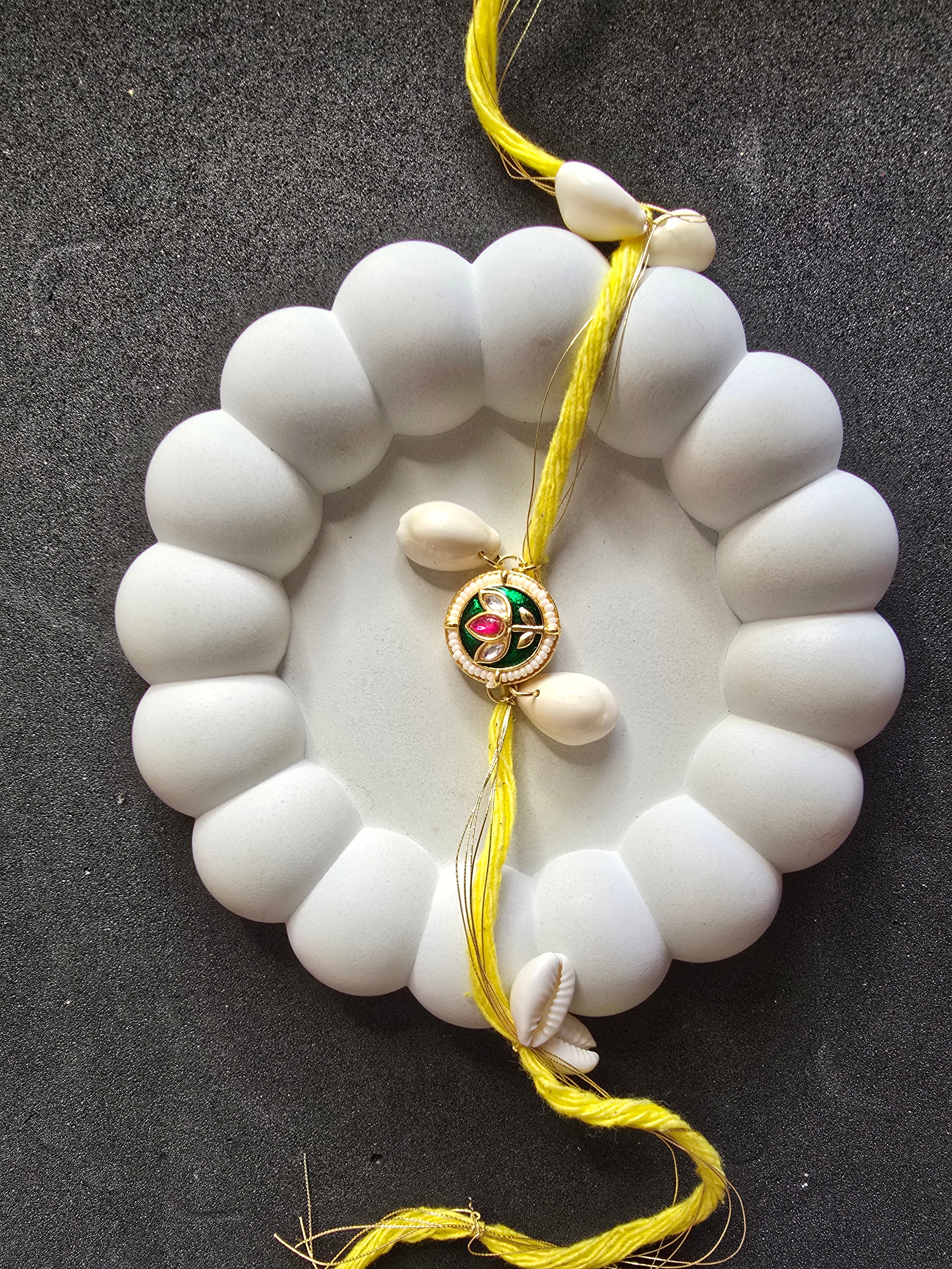 Bright Yellow Cowrie Shell Rakhi