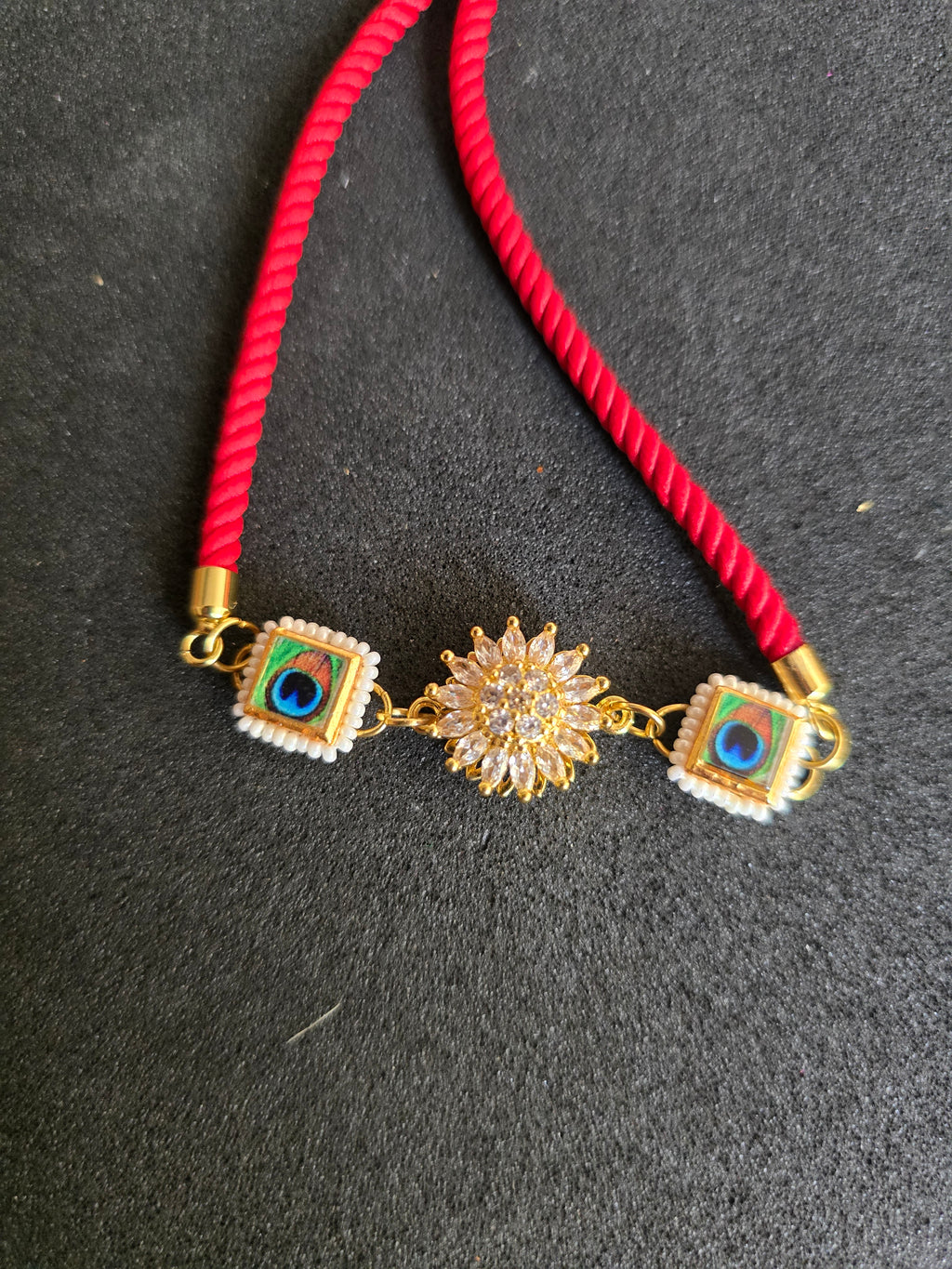 Elegant Peacock & Spining Floral Rakhi