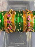 Elegant Emerald Green and Gold Bangle Set with Floral Accents