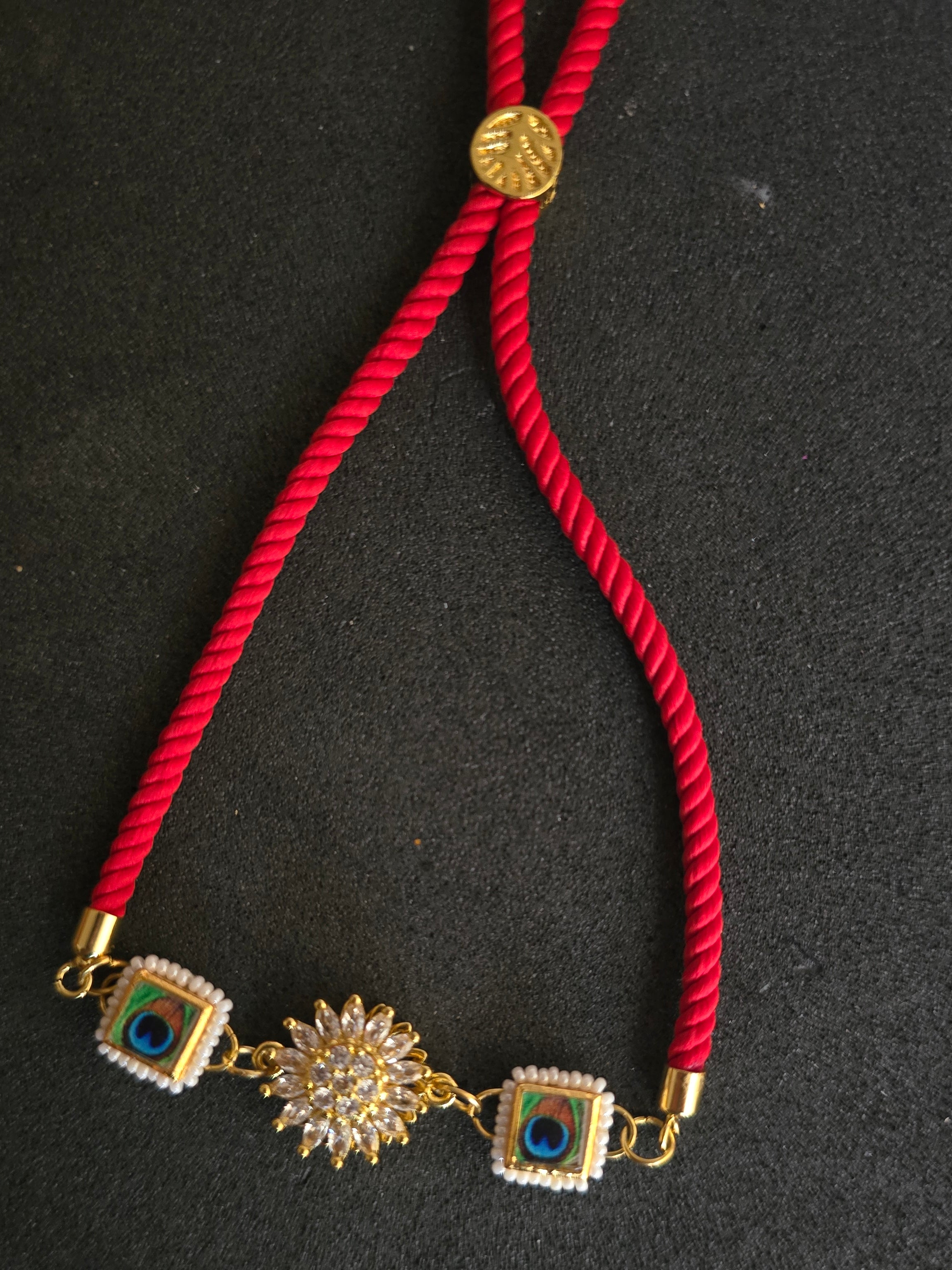 Elegant Peacock & Spining Floral Rakhi