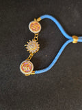 Swastika & Spining Floral Dial Rakhi