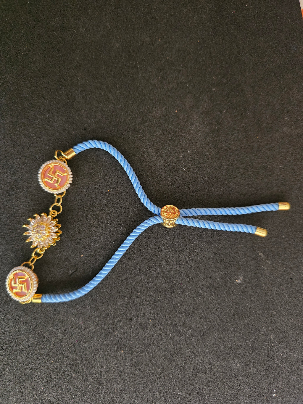Swastika & Spining Floral Dial Rakhi