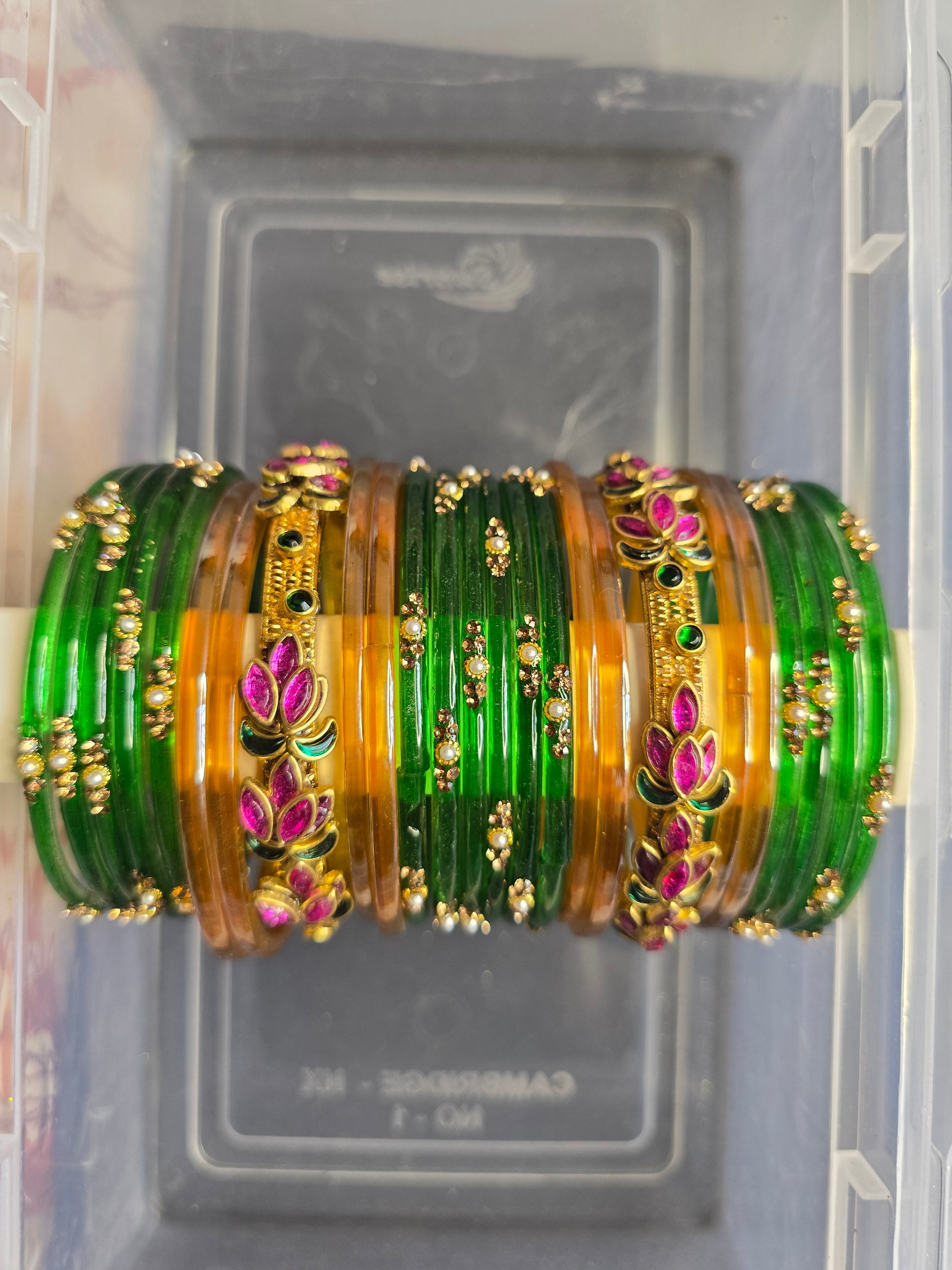 Elegant Emerald Green and Gold Bangle Set with Floral Accents